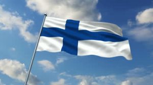 stock-footage-finnish-flag-waving-against-time-lapse-clouds-background